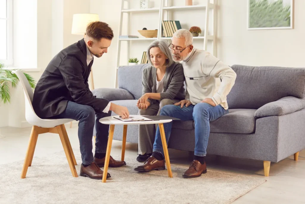 Senior couple discussing finances with an advisor